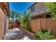 Private backyard patio with desert landscaping, a brick privacy wall, an outdoor ceiling fan, and a serene atmosphere at 1139 Via Partito, Henderson, NV 89052