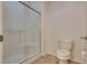 Bathroom with a glass door shower and a standard toilet with a white finish at 1139 Via Partito, Henderson, NV 89052