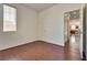 Comfortable bedroom with hardwood flooring and natural light, conveniently located near the kitchen at 1139 Via Partito, Henderson, NV 89052