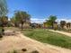 Well-maintained community park, featuring sidewalks, grass, trees, landscaping, and surrounding residences at 1139 Via Partito, Henderson, NV 89052