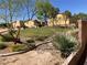 Exterior community space featuring grass, sidewalks, trees, and residential building exteriors at 1139 Via Partito, Henderson, NV 89052