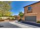 Exterior view of a two-story home with a two-car garage and well-maintained landscaping in a residential neighborhood at 1139 Via Partito, Henderson, NV 89052
