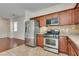 Modern kitchen featuring stainless steel appliances and granite countertops at 1139 Via Partito, Henderson, NV 89052