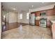 Open layout with kitchen featuring stainless steel appliances and tile floor at 1139 Via Partito, Henderson, NV 89052