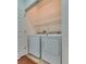 Laundry room with washer, dryer, and wire shelving for organized storage at 1139 Via Partito, Henderson, NV 89052
