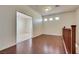 Loft area with wood flooring, open entrance, and natural light from multiple windows at 1139 Via Partito, Henderson, NV 89052