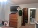 Comfortable bedroom with closet, tv and access to an ensuite bathroom at 1281 Challenge Ln, Las Vegas, NV 89110