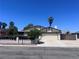 Charming single-story home featuring a well-maintained lawn and desert landscaping, with a two-car garage at 1281 Challenge Ln, Las Vegas, NV 89110