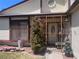 Protected front porch with security door, tasteful landscaping, and decor at 1281 Challenge Ln, Las Vegas, NV 89110