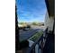 View from the condo balcony featuring a landscaped parking lot and street at 1440 Vegas Valley Dr # 2, Las Vegas, NV 89169