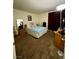 Cozy bedroom with brown carpet, a queen-sized bed, and warm lighting at 1440 Vegas Valley Dr # 2, Las Vegas, NV 89169