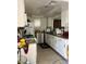 Bright kitchen featuring white cabinetry, tile flooring, and modern appliances at 1440 Vegas Valley Dr # 2, Las Vegas, NV 89169