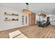 Open floorplan featuring a kitchen with white cabinets, a large island, and an adjacent dining area at 1551 Boundary Peak Way, Las Vegas, NV 89135