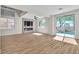 Bright living room with modern fireplace and sliding door to backyard at 1551 Boundary Peak Way, Las Vegas, NV 89135