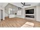Open-concept living room with fireplace and staircase to the second floor at 1551 Boundary Peak Way, Las Vegas, NV 89135