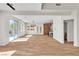Open-concept living room with sliding glass door to backyard pool and bar area at 1551 Boundary Peak Way, Las Vegas, NV 89135
