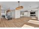 Open concept living space with kitchen, living room, hardwood floors and modern finishes at 1551 Boundary Peak Way, Las Vegas, NV 89135