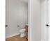 Powder room with wood vanity, modern fixtures, and neutral tones at 1551 Boundary Peak Way, Las Vegas, NV 89135