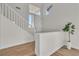 Well-lit staircase with white railings and natural wood treads at 1551 Boundary Peak Way, Las Vegas, NV 89135