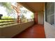 Balcony area with sliding glass doors and a view of mature trees at 1608 Sussex St # 204, Las Vegas, NV 89144