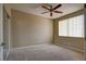 Well-lit bedroom with carpet, ceiling fan, window, and closet at 1608 Sussex St # 204, Las Vegas, NV 89144