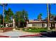 Community clubhouse, with lush landscaping and signage at 1608 Sussex St # 204, Las Vegas, NV 89144