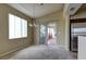 Bright dining area featuring large windows, a modern chandelier, and seamless access to the outdoors at 1608 Sussex St # 204, Las Vegas, NV 89144