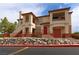 Inviting multi-Gathering home featuring warm stucco and accessible entrances with well maintained landscaping at 1608 Sussex St # 204, Las Vegas, NV 89144