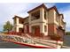 Inviting multi-Gathering home featuring warm stucco and accessible entrances with well maintained landscaping at 1608 Sussex St # 204, Las Vegas, NV 89144