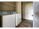 Functional laundry room with washer, dryer, and storage shelves at 1608 Sussex St # 204, Las Vegas, NV 89144