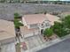 Two-story home with three-car garage and manicured lawn in a well-planned neighborhood at 1777 Antelope Valley Ave, Henderson, NV 89012