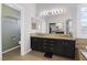 Bathroom featuring a double sink vanity, walk in closet and separate toilet area at 1777 Antelope Valley Ave, Henderson, NV 89012