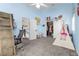 ' bedroom featuring blue walls, a lofted bed with desk, and white shutters at 1777 Antelope Valley Ave, Henderson, NV 89012