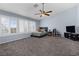 Spacious bedroom featuring large windows, ceiling fan, and comfortable furnishings at 1777 Antelope Valley Ave, Henderson, NV 89012