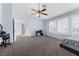 Bright bedroom with neutral tones, windows, and a simple make up vanity at 1777 Antelope Valley Ave, Henderson, NV 89012