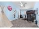 Cozy ' bedroom featuring blue walls, white trim and a ceiling fan at 1777 Antelope Valley Ave, Henderson, NV 89012