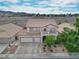 Charming two-story home featuring a three-car garage and a well-manicured front yard at 1777 Antelope Valley Ave, Henderson, NV 89012
