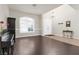 Bright foyer with arched window, chandelier, and tile and wood flooring at 1777 Antelope Valley Ave, Henderson, NV 89012