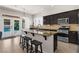 Stylish kitchen island with counter seating and backyard access, perfect for entertaining at 1777 Antelope Valley Ave, Henderson, NV 89012