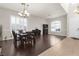 Open concept living space featuring dark wood floors and plantation shutters at 1777 Antelope Valley Ave, Henderson, NV 89012
