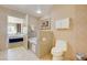 Cozy bathroom featuring a toilet, bathtub and an open doorway to a bedroom at 211 E Flamingo Rd # 620, Las Vegas, NV 89169