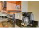 Granite countertops, wood cabinets, stainless oven and coffee maker featured in the kitchen at 211 E Flamingo Rd # 620, Las Vegas, NV 89169