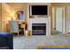 Cozy living room features a fireplace, desk, and ample natural light at 211 E Flamingo Rd # 620, Las Vegas, NV 89169