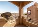 A well-lit balcony with textured walls and railings overlooks a city view at 2191 Bay Club Dr # 204, Laughlin, NV 89029
