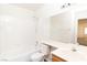 Well-lit bathroom features a shower-tub combo with tiled walls and a vanity sink at 2191 Bay Club Dr # 204, Laughlin, NV 89029