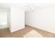 Well-lit bedroom with plush carpet, neutral walls, and a ceiling fan at 2191 Bay Club Dr # 204, Laughlin, NV 89029