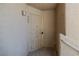 Close-up of unit 204 entryway featuring a sturdy security door and wall sconce at 2191 Bay Club Dr # 204, Laughlin, NV 89029