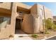 Attractive condo building showcasing the exterior with stucco and desert landscaping at 2191 Bay Club Dr # 204, Laughlin, NV 89029