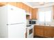 The kitchen features a refrigerator, range, and stainless steel sink at 2191 Bay Club Dr # 204, Laughlin, NV 89029