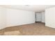 Inviting living room with neutral carpet, white walls, and natural light at 2191 Bay Club Dr # 204, Laughlin, NV 89029